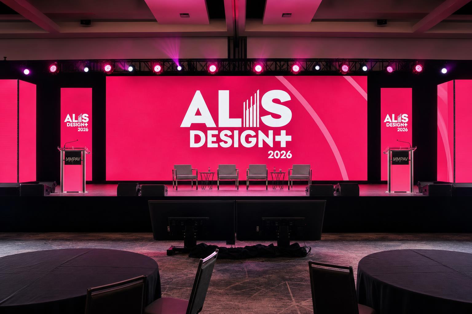 Flashy ALIS Design+ stage with vibrant pink LED screens showing bold motion-graphics branding for keynote content
